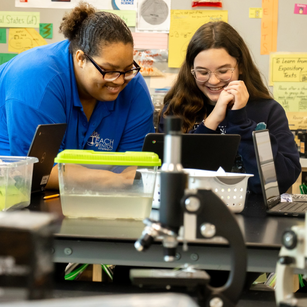 Students and staff smiling 